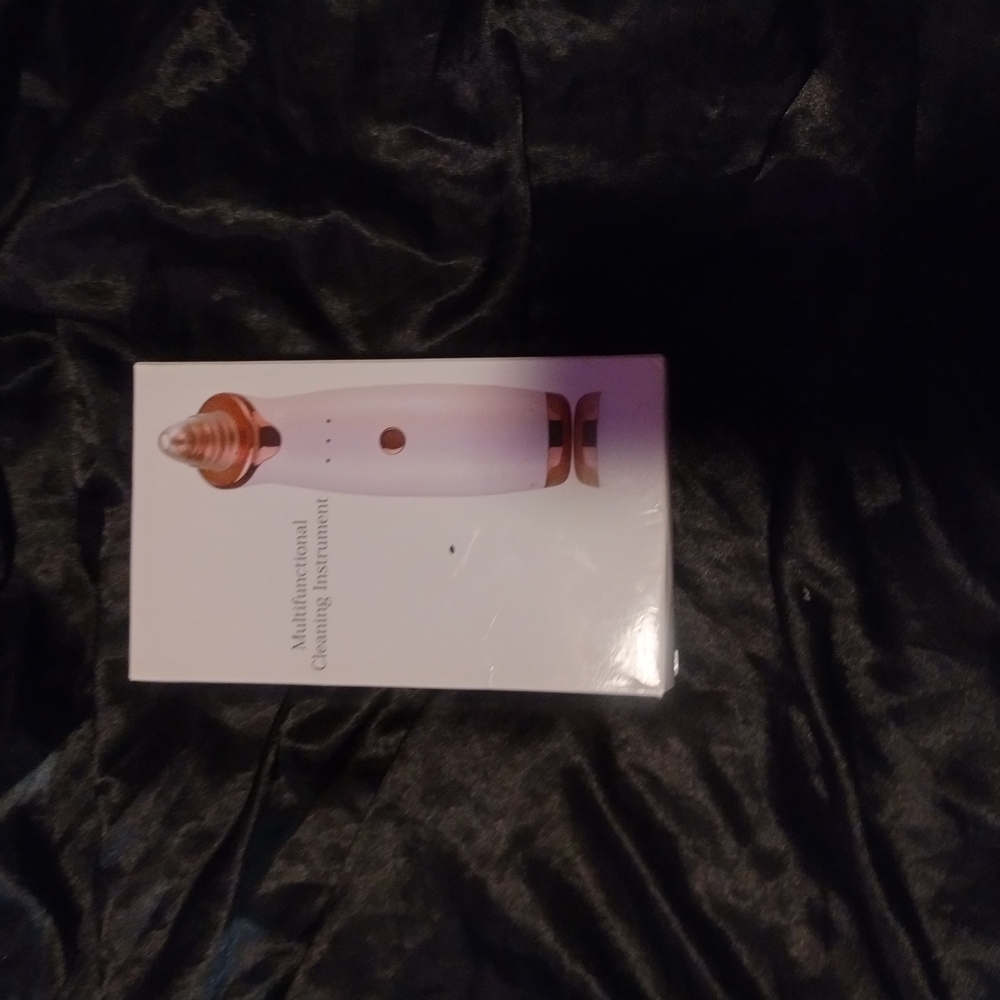 White and Rose Gold Cleansing Device